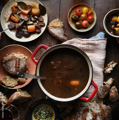 Foto Dinner table with a beef stew food photography recipe idea