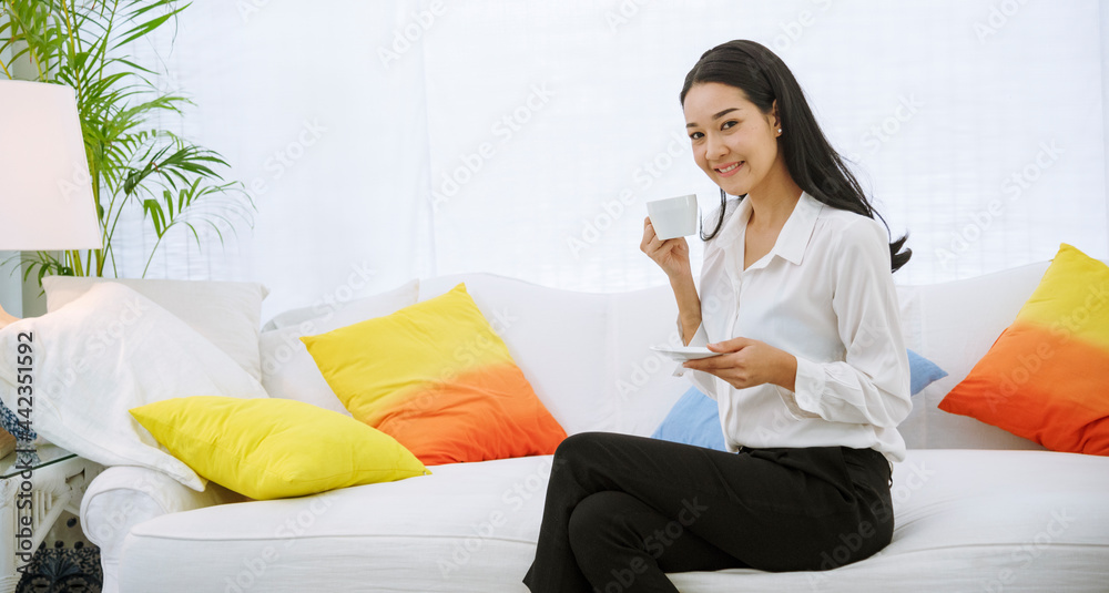 Woman holding coffee cup relaxing after work at office warm taste in cafe. Close up hands of woman sitting office desk holding sweet coffee cup relax and enjoy with happy time. Hot coffee mug in hand Woman holding coffee cup relaxing after work at office warm taste in cafe. Close up hands of woman sitting office desk holding sweet coffee cup relax and enjoy with happy time. Hot coffee mug in hand