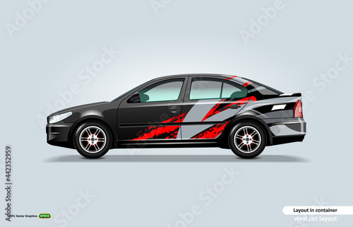 Car decal wrap design with abstract stripe theme on black sedan car.
