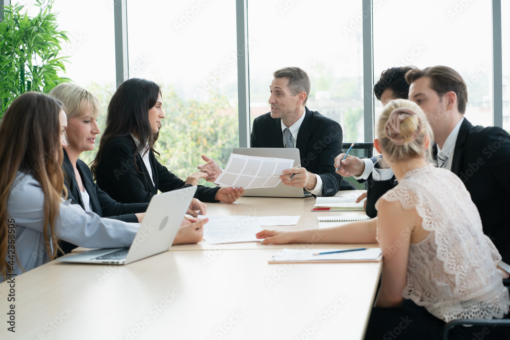 group of business people working and disussing a project together at meeting room group of business people working and disussing a project together at meeting room