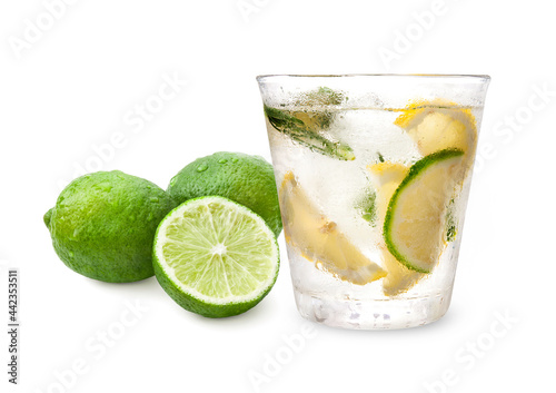 Glass with lemon, lime, rosemary, ice and soda water on white background.