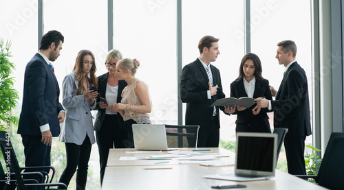 group of business people working and disussing a project together at meeting room