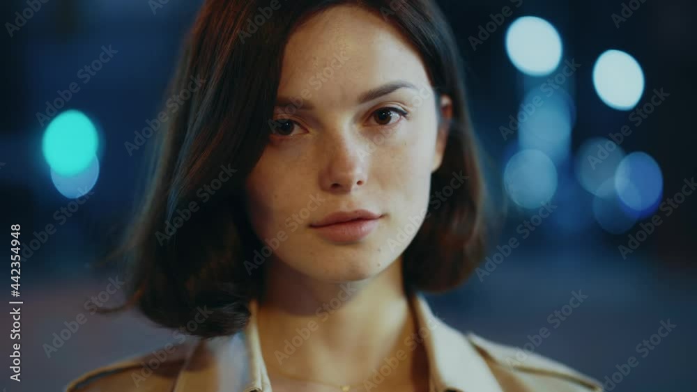 Portrait beautiful woman face looking at camera outdoors. Natural beauty lady on street. City, night, girl, light, outside, beauty, evening, lifestyle, standing. Slow motion Portrait beautiful woman face looking at camera outdoors. Natural beauty lady on street. City, night, girl, light, outside, beauty, evening, lifestyle, standing. Slow motion