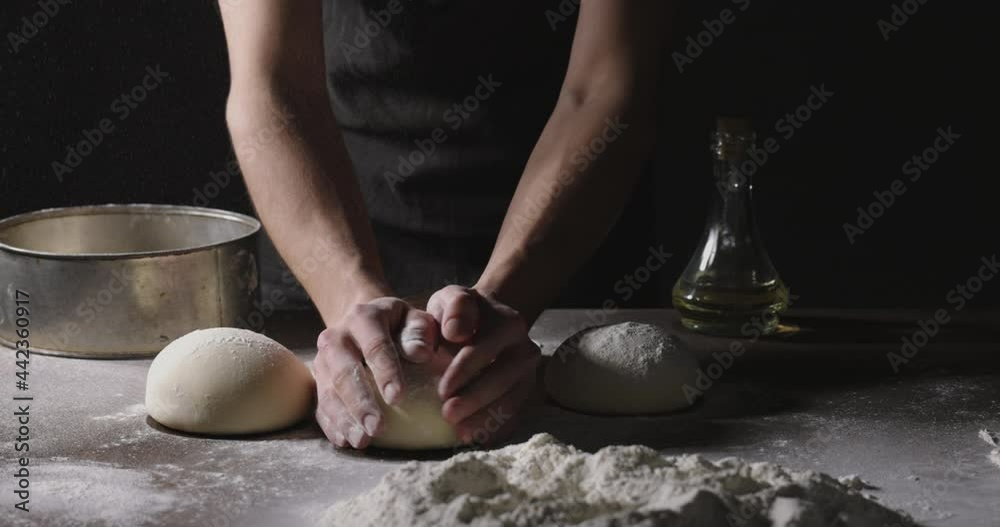 Bakery worker forming loafs of organic bread. Cooker making dough with natural ingredients. Hands covered in flour close up 4k footage Bakery worker forming loafs of organic bread. Cooker making dough with natural ingredients. Hands covered in flour close up 4k footage