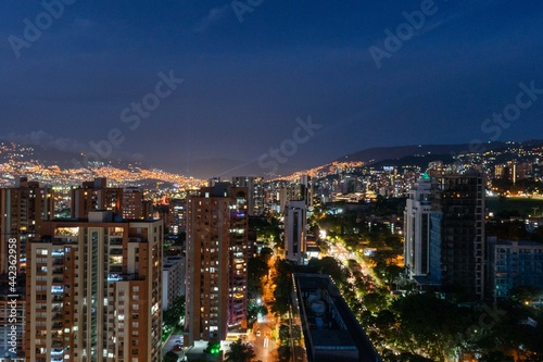 Medellin, Antioquia, Colombia. December 21, 2020: Night urban landscape with buildings in El Poblado.
