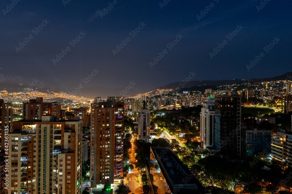 Medellin, Antioquia, Colombia. December 21, 2020: Night urban landscape with buildings in El Poblado.