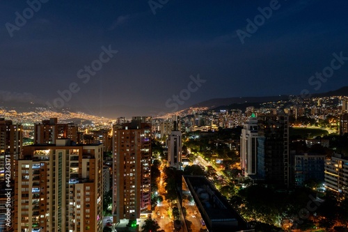 Medellin, Antioquia, Colombia. December 21, 2020: Night urban landscape with buildings in El Poblado. © camaralucida1