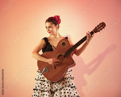 Flamenco dancer spain woman gypsy with red rose and spanish guitar