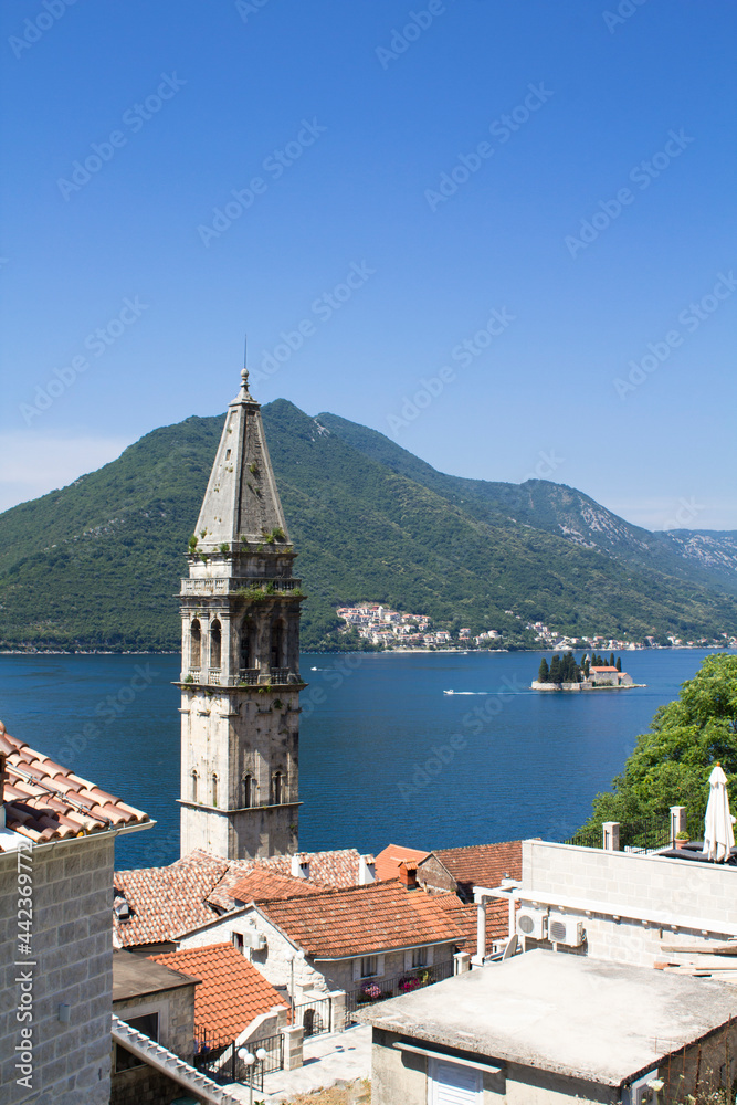 Panoramic view of the city, island and bay on the sunny day. Perast. Montenegro.