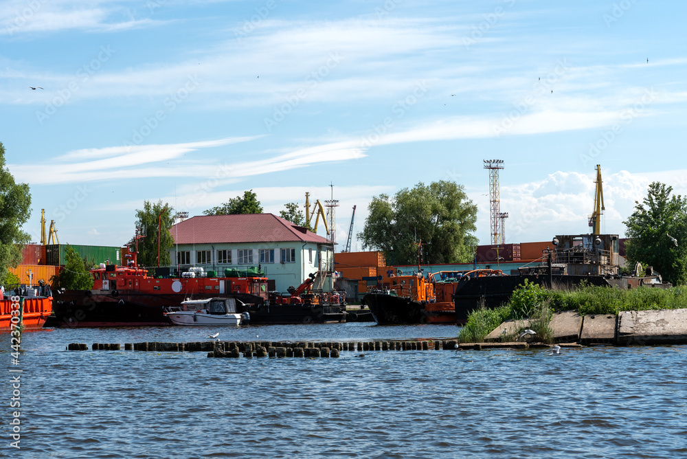 A fleet of tugs moored at the port in the city of Kaliningrad.