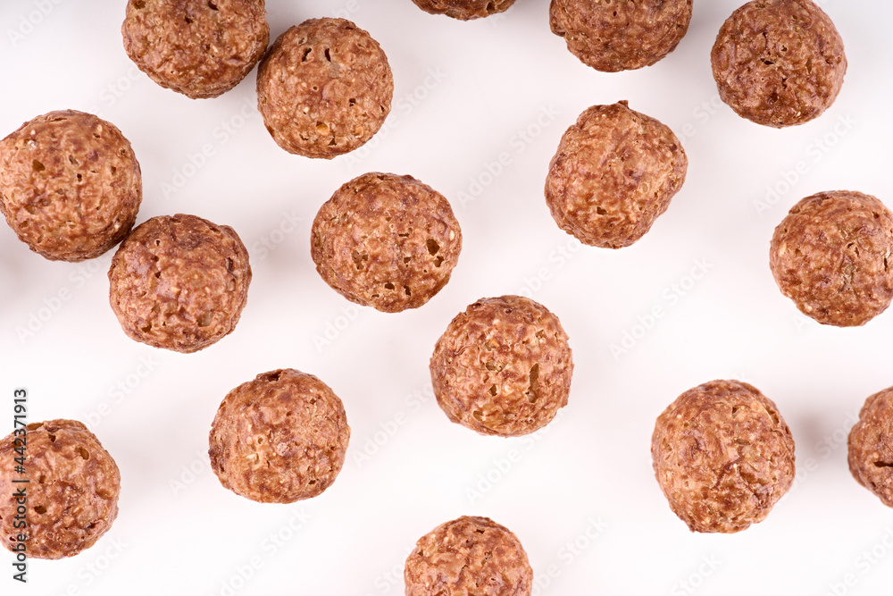 Variety of cold cereals, quick breakfast for kids overhead shot. Quick breakfast. Chocolate balls isolated on a white background. Variety of cold cereals, quick breakfast for kids overhead shot. Quick breakfast. Chocolate balls isolated on a white background.