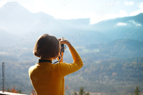 girl takes pictures on camera