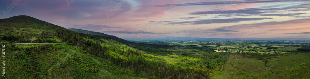Fototapeta premium Panoramic view of the Vee Pass, a v-shaped turn on the road leading to a gap in the Knockmealdown mountains in Clogheen county Tipperary, Ireland