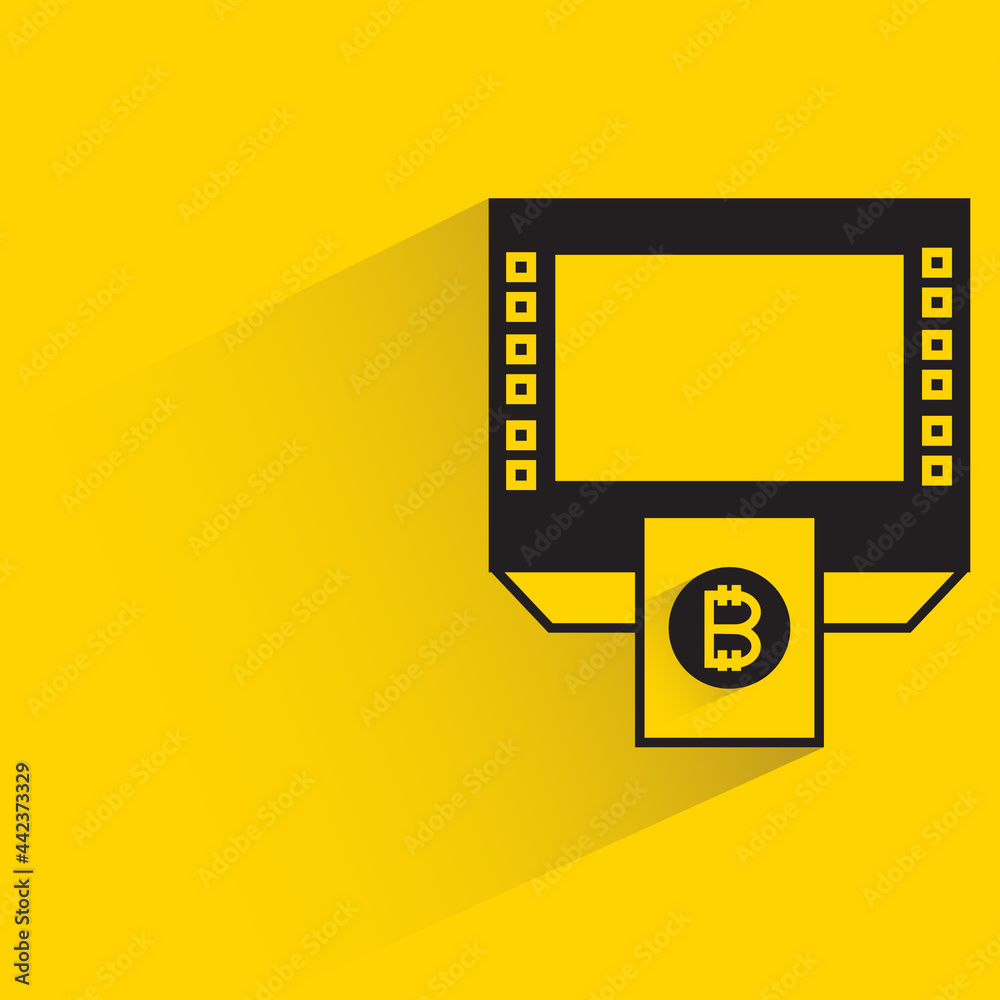 bitcoin atm machine with shadow on yellow background bitcoin atm machine with shadow on yellow background