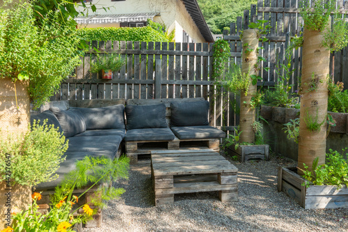 sitting area and plants in a garden