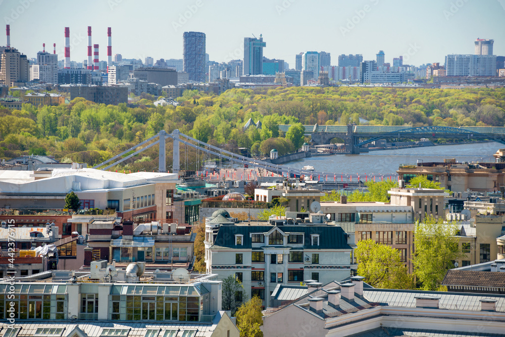 Fototapeta premium Top view of the rooftops of residential buildings in the Khamovniki district, Moscow and Moscow River from height