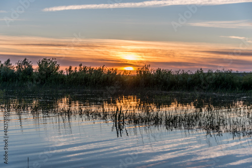 Fototapeta Naklejka Na Ścianę i Meble -  Sunset with Reflections at a Lake in Latvia