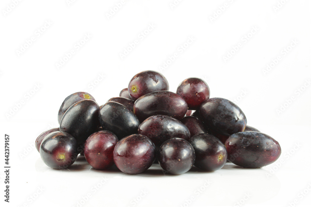 Pile of dark grapes isolated on white background. Pile of dark grapes isolated on white background.