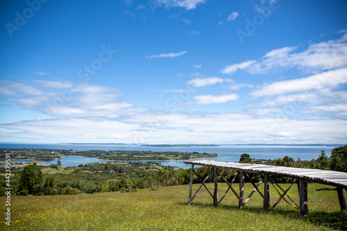 Dock of the islands viewpoint, located on Mechuque Island, Chiloé in southern Chile. With blue sky with some clouds