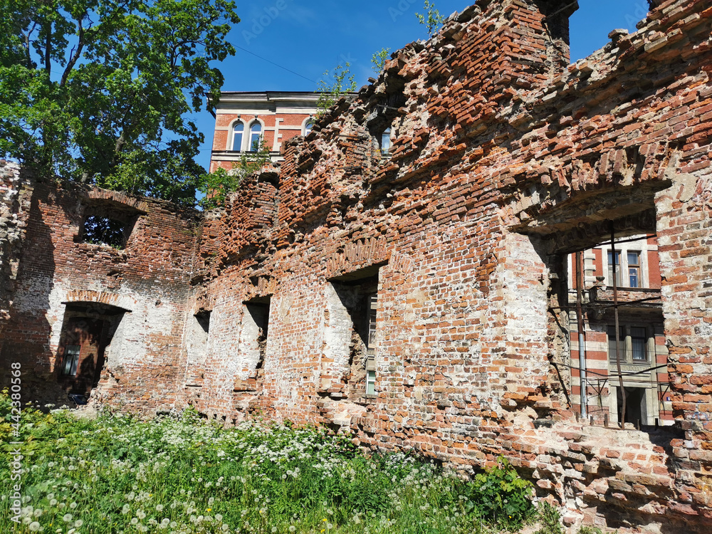 The destroyed walls of the Vyborg Cathedral in the city of Vyborg against the blue sky.