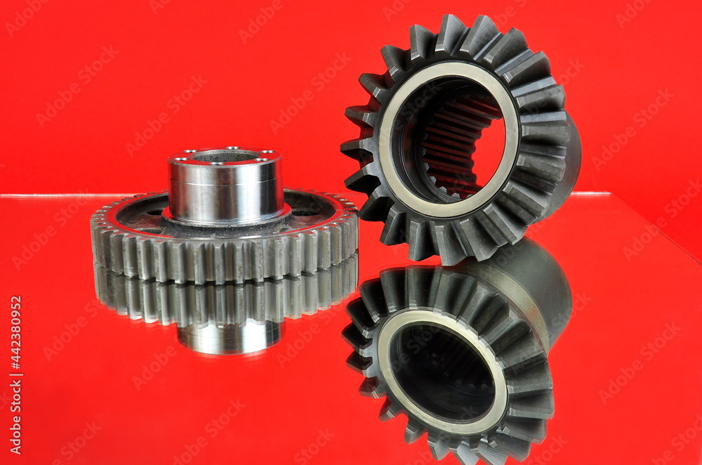 Cogwheels on a mirror surface. Spare parts. Cogwheels on a mirror surface. Spare parts.