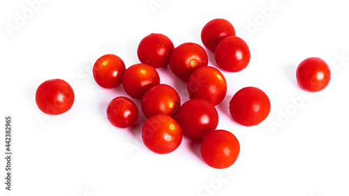 Fresh cherry tomatoes isolated on a white background.