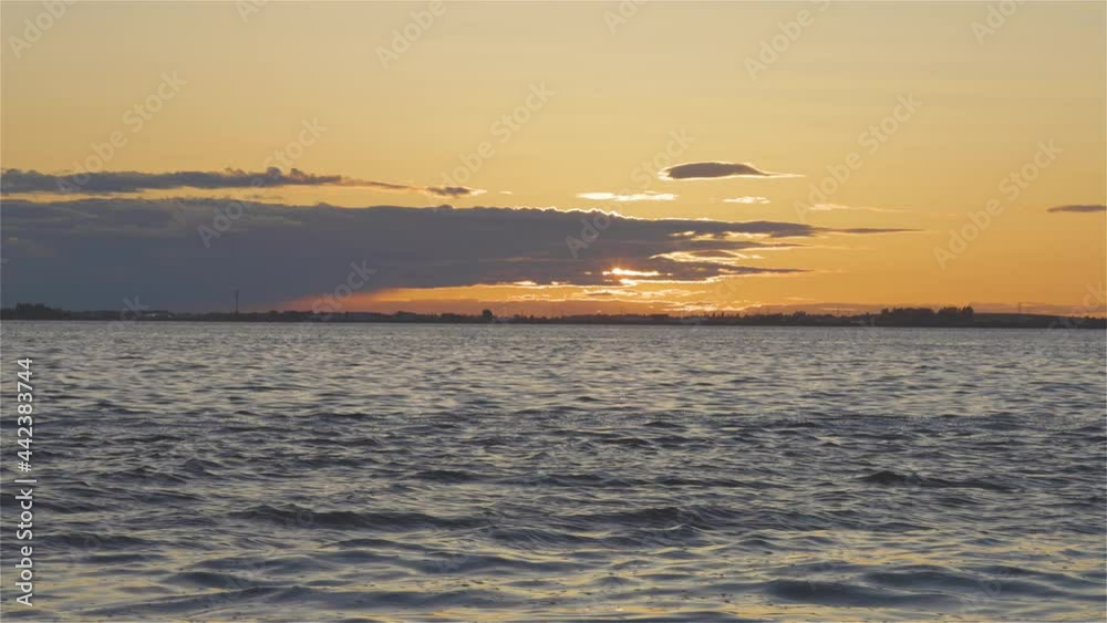 White Rock, Greater Vancouver, British Columbia, Canada. Colorful and Vibrant View of a cloudy and colorful sunset over the Pacific Ocean Coast. Nature Background White Rock, Greater Vancouver, British Columbia, Canada. Colorful and Vibrant View of a cloudy and colorful sunset over the Pacific Ocean Coast. Nature Background
