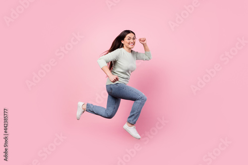 Fototapeta Naklejka Na Ścianę i Meble -  Full size profile side photo of attractive mature woman run empty space sale isolated on pink color background