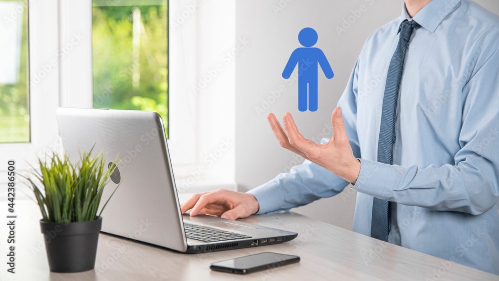 Businessman holds man person icon on dark tone background.HR Human ,people iconTechnology Process System Business with Recruitment, Hiring, Team Building. Organisation structure concept Businessman holds man person icon on dark tone background.HR Human ,people iconTechnology Process System Business with Recruitment, Hiring, Team Building. Organisation structure concept