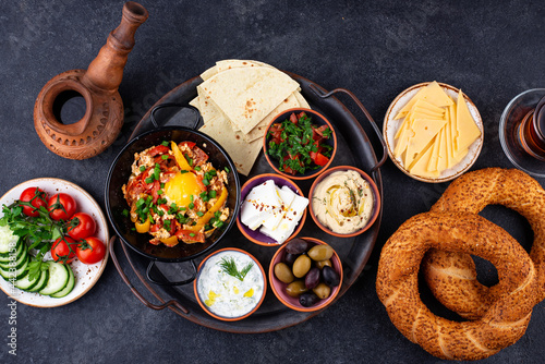 Traditional Turkish breakfast with meze and simit photo