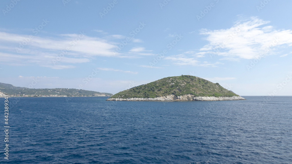 View of the mountains of an Aegean Island in Greece. Shooting from water. View of the mountains of an Aegean Island in Greece. Shooting from water.