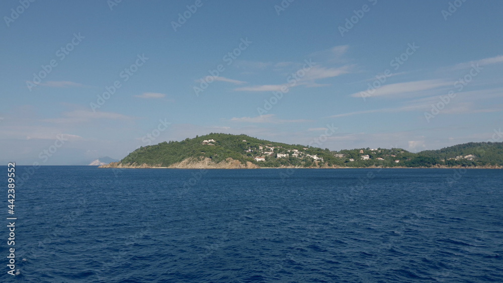 View of the mountains of an Aegean Island in Greece. Shooting from water.