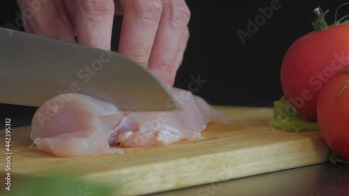Chicken breast is cut into slices