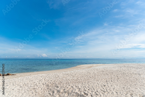 Nature in twilight period which including of sunrise over the sea and the nice beach. Summer beach with blue water and purple sky at the sunset.  