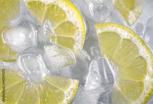 Fresh lemon slices on ice.