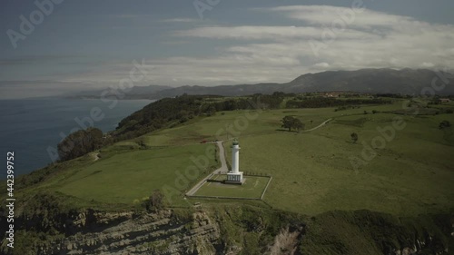 Aerial video view of the Luces lighthouse in Colunga, Asturias. Spain. photo