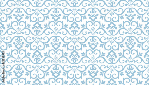Wallpaper in the style of Baroque. Seamless vector background. White and blue floral ornament. Graphic pattern for fabric, wallpaper, packaging. Ornate Damask flower ornament