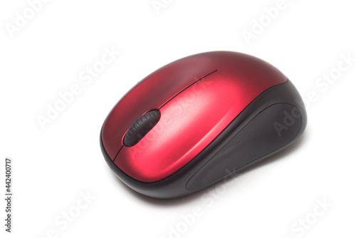 Closeup of red and black wireless mouse of computer on white background