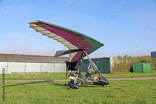 Ultralight airplane on a grass airfield
