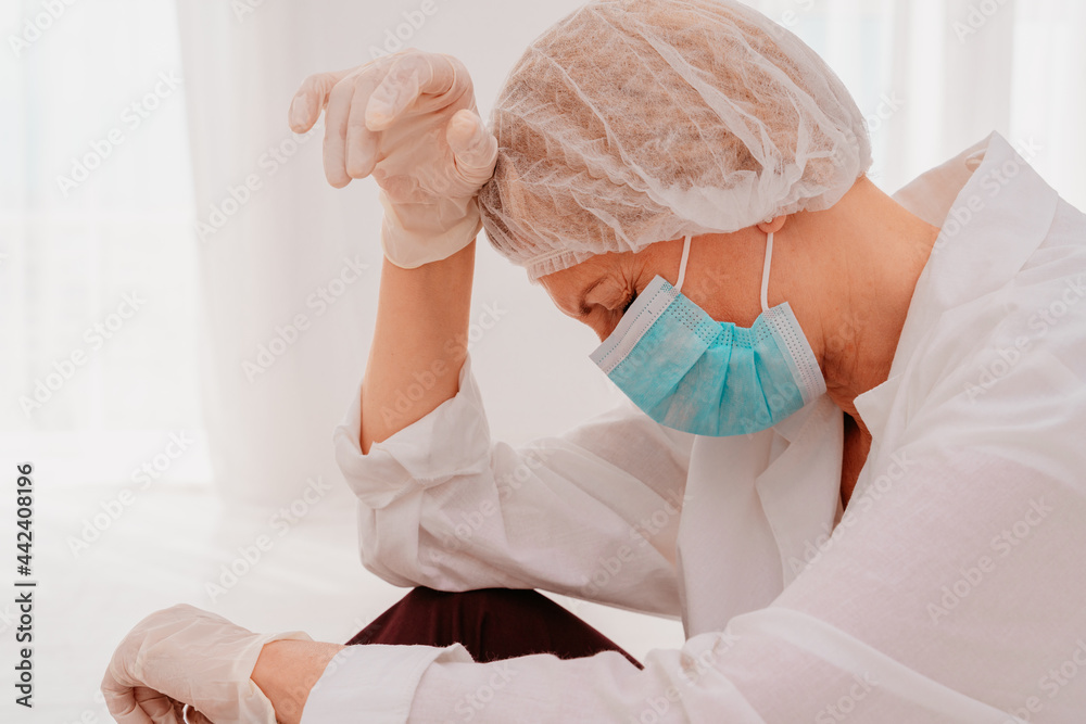 Fototapeta premium doctor is tired and stressed due to covid-19 virus pandemic