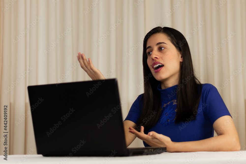 woman working on laptop. Person talking on the computer, laptop. giving classes, exposing. virtual. isolated. Latin woman. Christian and religious woman. woman working on laptop. Person talking on the computer, laptop. giving classes, exposing. virtual. isolated. Latin woman. Christian and religious woman.