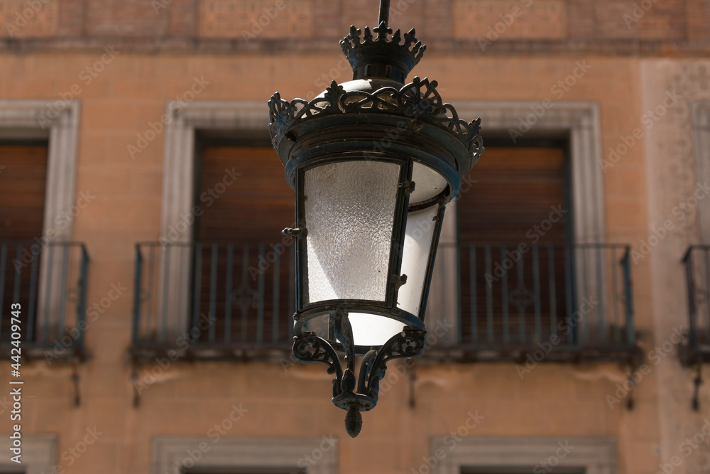 One of the classic style wrought iron lamps that hang in the arcades of the Aqueduct Avenue, in the downtown area