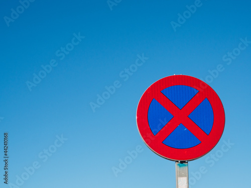 Traffic sign prohibiting parking with blue sky and copy space