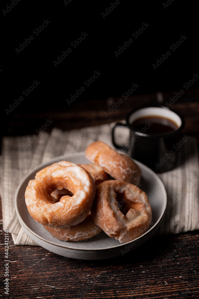 glazed old fashioned style doughnut on dark background glazed old fashioned style doughnut on dark background