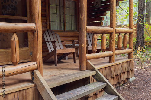 View of Front Porch of Rustic Log Cabin in the Woods