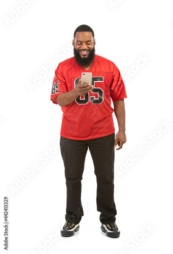 Fan: Man In Sports Jersey Using Cell Phone © seanlockephotography