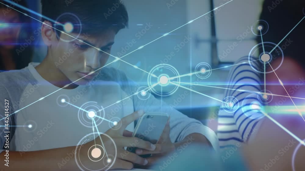 Animation of network of connections moving over schoolboy using smartphone in classroom Animation of network of connections moving over schoolboy using smartphone in classroom