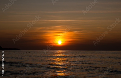 Fototapeta Naklejka Na Ścianę i Meble -  beautiful sunset on the sea. beach and surf at sunset.