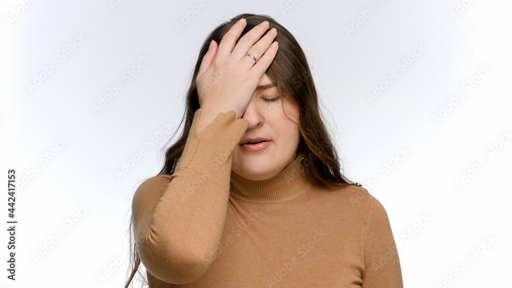 Upset and stressed woman shaking head and making facepalm gesture. Concept of frustration and disappointment. Upset and stressed woman shaking head and making facepalm gesture. Concept of frustration and disappointment.