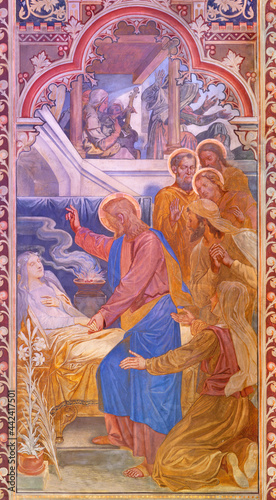 VIENNA, AUSTIRA - JUNI 24, 2021: The fresco of The Raising of Jairus' Daughter in the Votivkirche church by brothers Carl and Franz Jobst (sc. half of 19. cent.). photo
